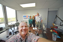 Photographers Harry Gerwien and Erin Clark join Nora Firestone and Larry Cobb at WKQA studio.